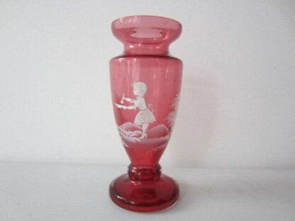 Mary Gregory enamel painted cranberry urn shaped art glass vase.